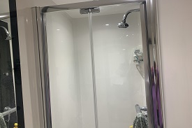 En suite bathroom with a shower cubicle shown here.