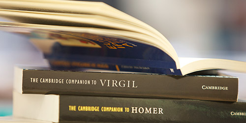 A stack of three books, including the Cambridge Companion to Virgil and the Cambridge Companion to Homer.