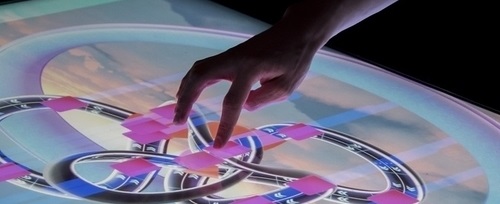 A hand using a touch screen to demonstrate digital futures technologies 