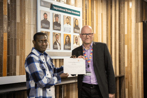 Photo of Jerry Mintah being presented with his certificate by Dean of Science, Jens Marklof.