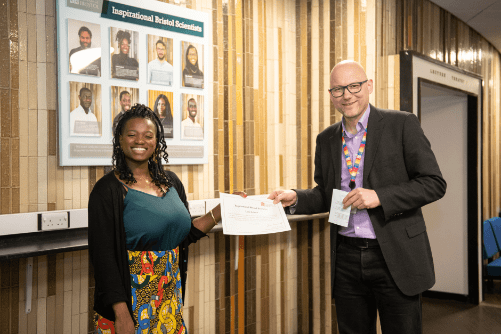 Photo of Lara Lalemi being presented with her certificate by Dean of Science, Jens Marklof.