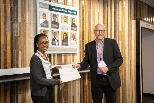 Photo of Sbu Mbatha being presented with her certificate by Dean of Science, Jens Marklof.