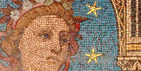 Detail of a mosaic showing a face on a blue ground