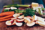 Selection of neatly chopped vegetables on a chopping board