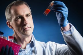 Colum Walsh holding a test tube