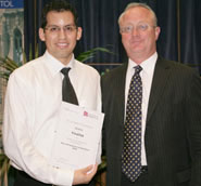 Third prize winners, Meebots: Renato Salas (left) with Vice-Chancellor Eric Thomas