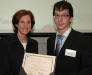 Philip Pearson receives his award from Marissa Dineen, GE Managing Director of Corporate Financial Services Europe