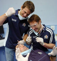 Members of Bristol Rugby team practise their dentistry skills