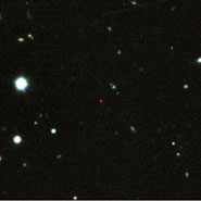 This image shows the afterglow of GRB 090423 (the red source in the centre) and was created from images taken at Gemini-South and the Very Large Telescope