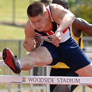 Lawrence Clarke competing in a hurdles race