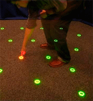 A participant activating a (red) target location in the search laboratory