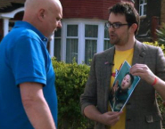 Ted Wilkes, right, speaks to someone about Kim Jong-Un for the 'Embracing Kim' mockumentary