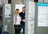 Delegates present posters of their PhD research