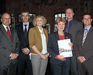 From left to right: Andrew Crossley; Gareth Coles, WCVA; Rhian Edwards, Wales Co-operative Centre; Jane Hutt, AM Minister For Finance, Welsh Government - holding the brochure for the manual; Matthew Pugh and Ben Wheeler, Thatreallyusefulcompany