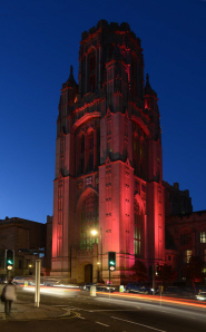 The Wills Memorial Building lit up in pink