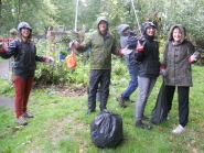 Volunteers collect rubbish in the garden at Easton Community Centre