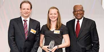 Brittany Harris collecting her award from Sir Trevor McDonald (who hosted the awards) and Mark Richardson from the sponsor Laing O’Rourke