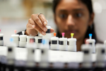 Researcher in chemistry lab selecting sample