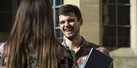 Image of student smiling outside Bristol University 
