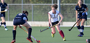 Two teams playing hockey at Coombe Dingle Sports Complex. Image links to further information about Coombe Dingle Sports Complex.