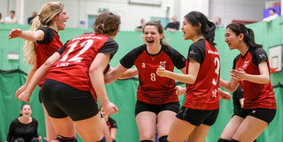 Girls celebrating volleyball win, select image to go to Bristol SU 