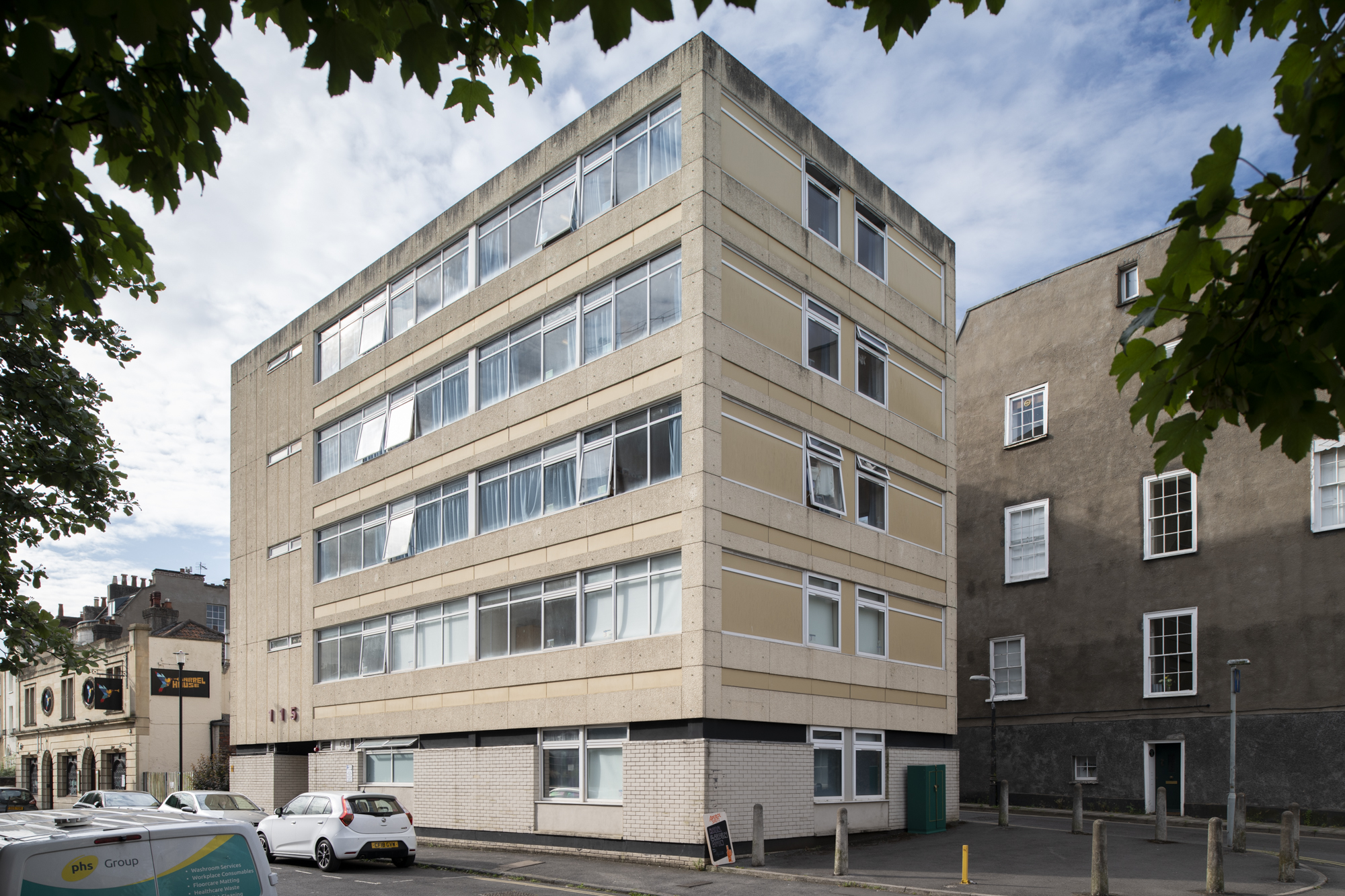 Exterior view of 115 Queens Road, a five storey modern building