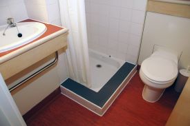 Bathroom with toilet, shower and sink
