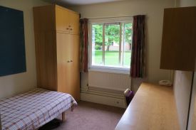 Bedroom  with single bed, wardrobe, desk and chair