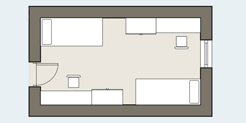 Floor plan of a room with a bed in a corner to the left of the door into the room and a desk and chair in the corner to the right. Another bed and another chair are in the far end of the room from the door, in opposite corners to the others.