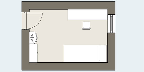 Floor plan of a room with a door in one corner, a desk and chair in the corner directly ahead of the door, a bed in the corner opposite the door, a wardrobe in the corner nearest the door, and a basin against the wall between the wardrobe and the door.