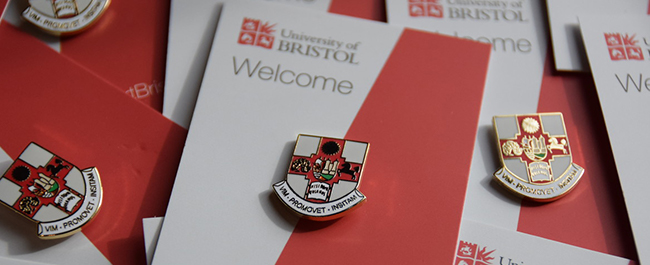 University of Bristol crest on badges pinned to cardboard