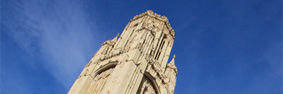 The Wills Memorial Building displayed against a blue sky.