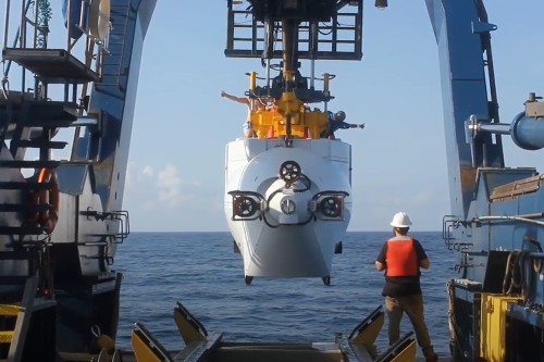 HOV Alvin being lowered into the Galápagos marine reserve. The submersible can take two scientists to depths of 6,500 metres.