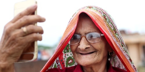 Elderly Indian lady taking selfie