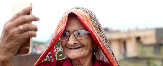 Elderly Indian lady taking selfie