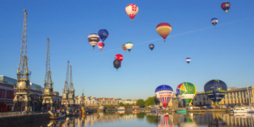 View across Bristol harbourside, showing air balloons.