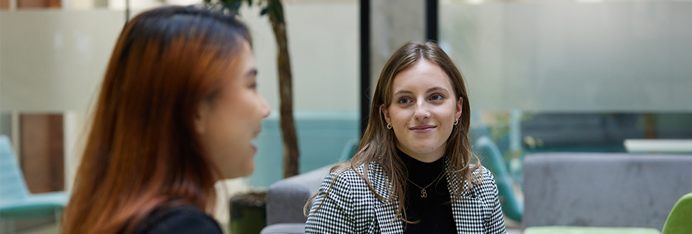 Two students in conversation