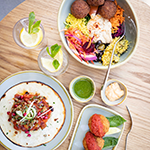 Image of plant-based tostada and salad bowl with falafel