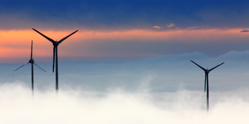 Wind terminal blades at sunset above the clouds, select to go to the Research partnerships and collaborations web page.