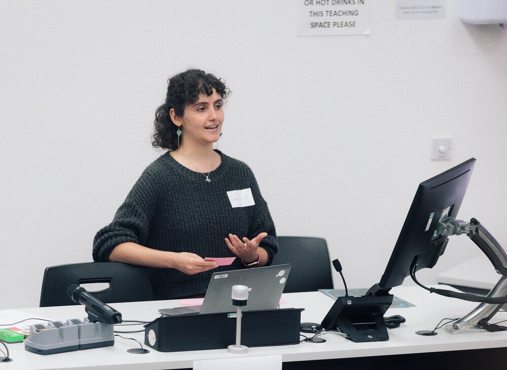 Female student at a lectern
