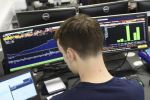 Student working in bloomberg trading room