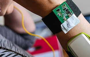 Close up of wristband with wearable digital tech