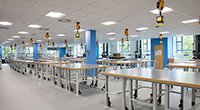 Inside the General Engineering lab showing a large number of tables in a brightly lit room