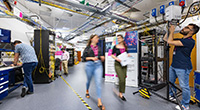 Two women walking through the Smart Internet Lab facility
