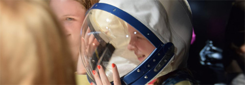 Head shot of girl wearing a space suit