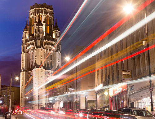 Wills Memorial Building at night with blurred car lights trail effect 