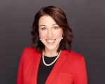 A headshot of Brianne Doura Schawohl, CEO of Doura - Schawohl Consulting LLC