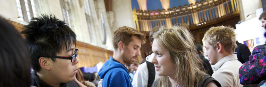 People of different races and genders talking to each other in the Wills Memorial Building.