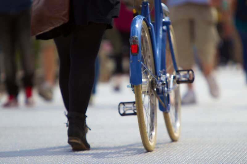 woman walking with bicycle