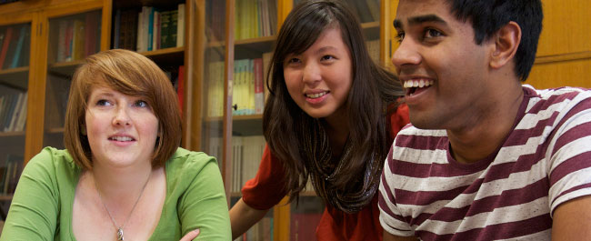 three students laughing 